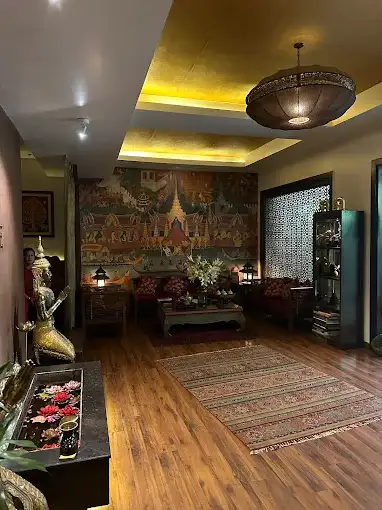 Thai-inspired lounge with traditional mural