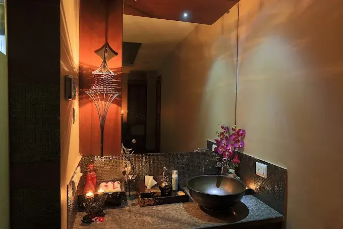 Elegant vanity and washroom at Just Relax Thai Spa